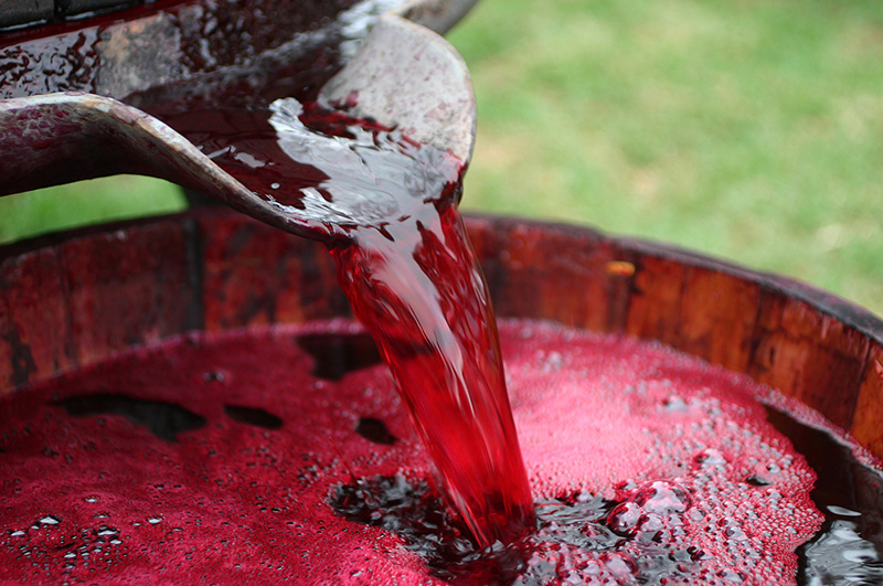 red-wine-barrel-pour